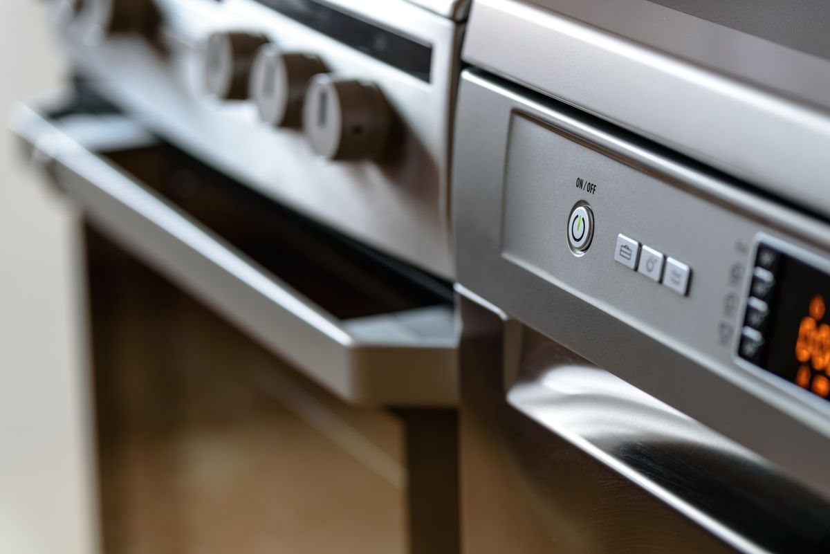 Stainless steel dishwasher and kitchen appliances in a modern kitchen